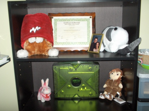 Xbox guarded by Bun-Bun, Ryo-Ohki wearing the Fez of Gaming Power, the Monty Python bunny, and Lain...I have nothing to fear.